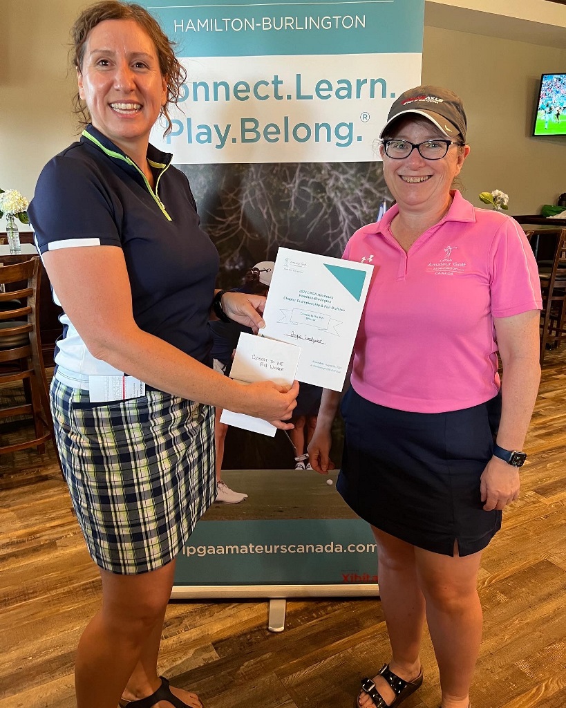 Angie Lundquist accepting the prize for Closest to the Pin