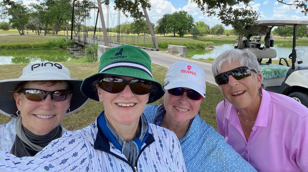 A group of female golfers taking a selfie during a round of golf in Houston Texas
