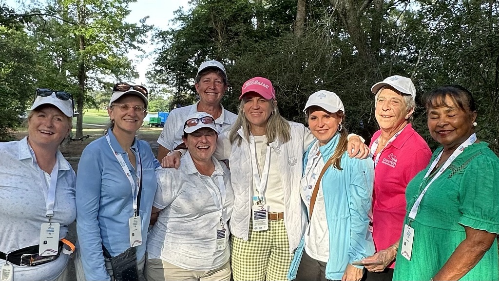 A group of female golfers posing for a picture before an exclusive event in Houston Texas