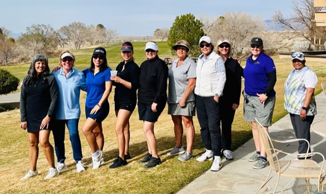 Group of women golfers posing together on a sunny day in Albuquerque, New Mexico