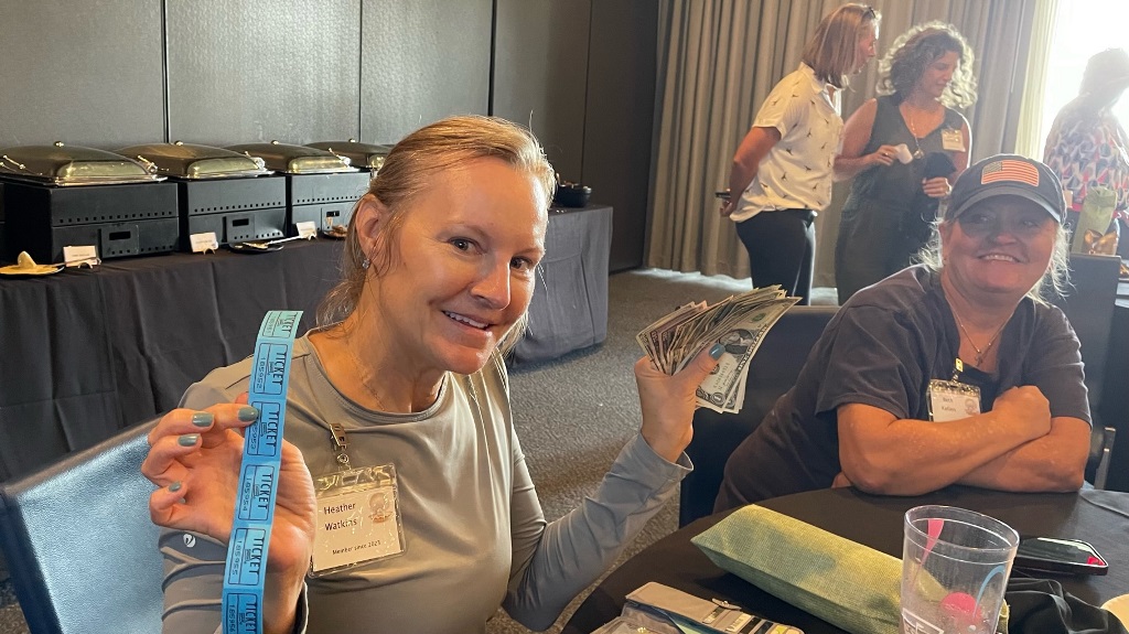 A female golfer celebrating her raffle win during a golf event in Houston Texas