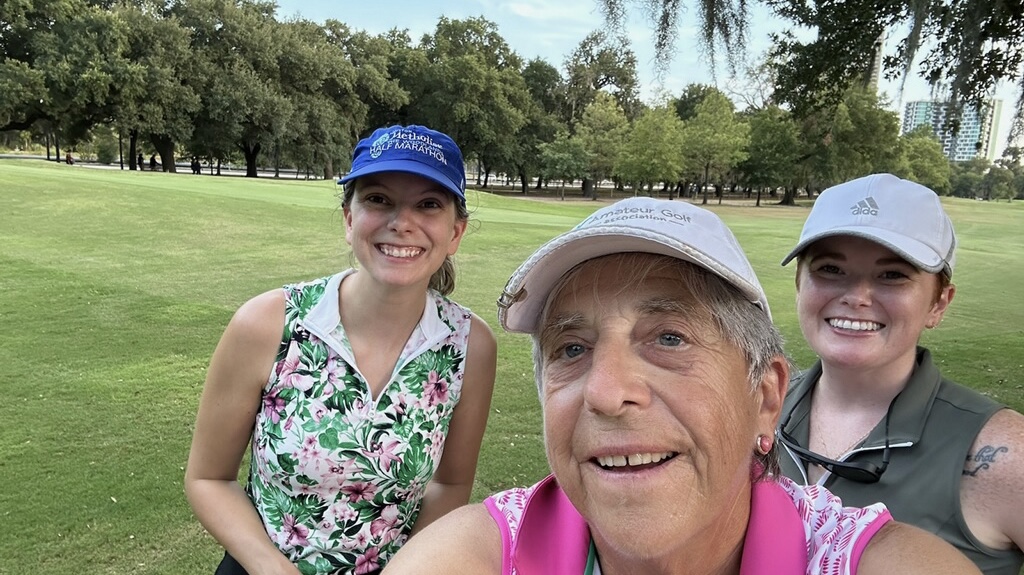 Three female golfers taking a selfie during a round of golf in Houston Texas