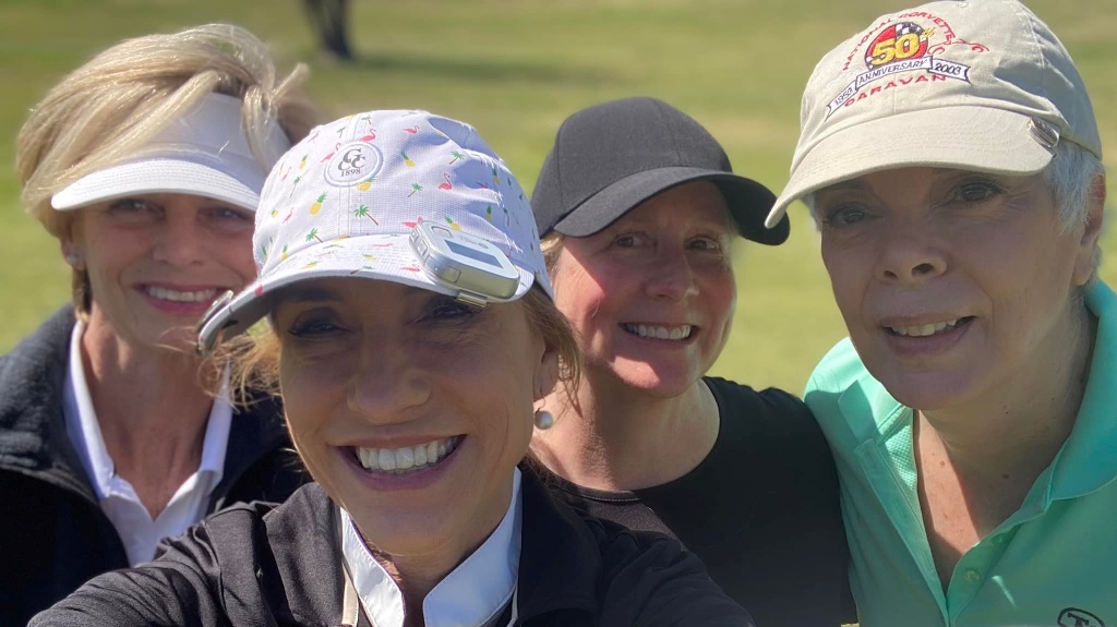 A group of female golfers posing for a selfie during a round of golf at Hermann Park in Houston Texas