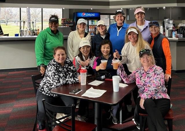 A group of female golfers celebrating a round of golf over drinks at the clubhouse in Houston Texas