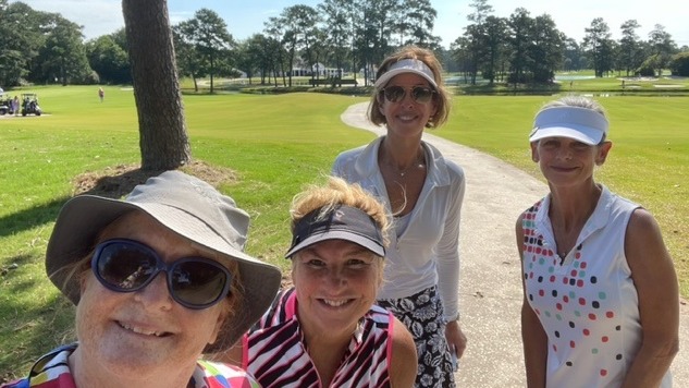 Four female golfers playing a round of golf on a sunny day in Houston Texas