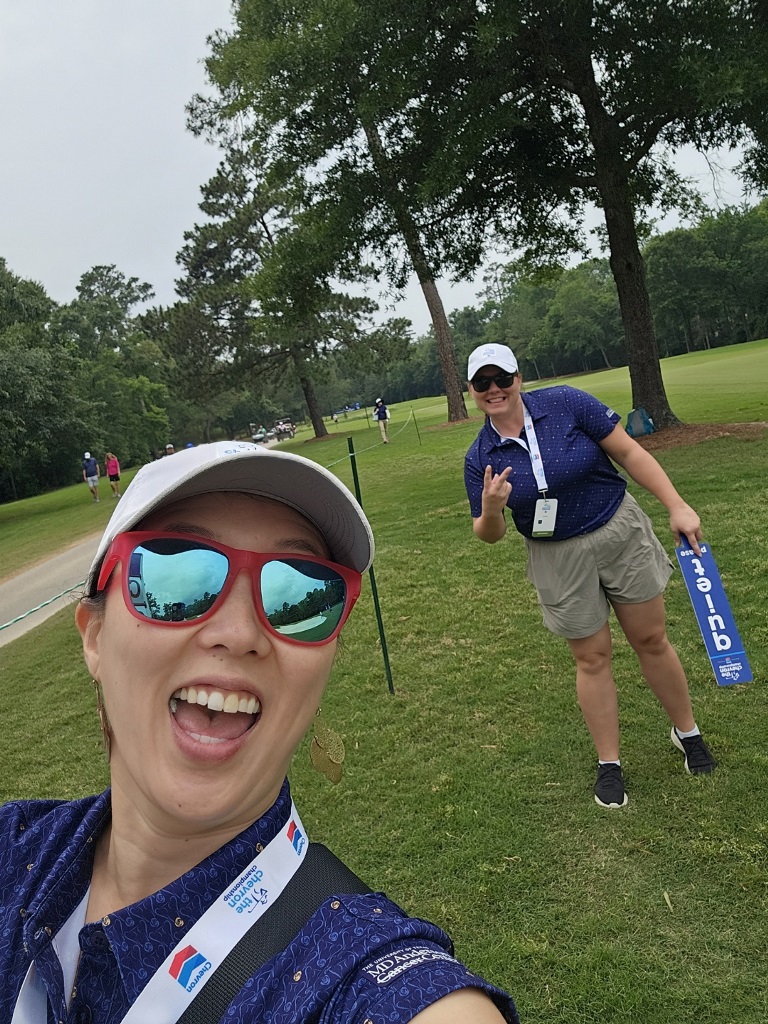 Two women taking a selfie while on the golf course at the LPGA Chevron Championship in the Woodlands Texas