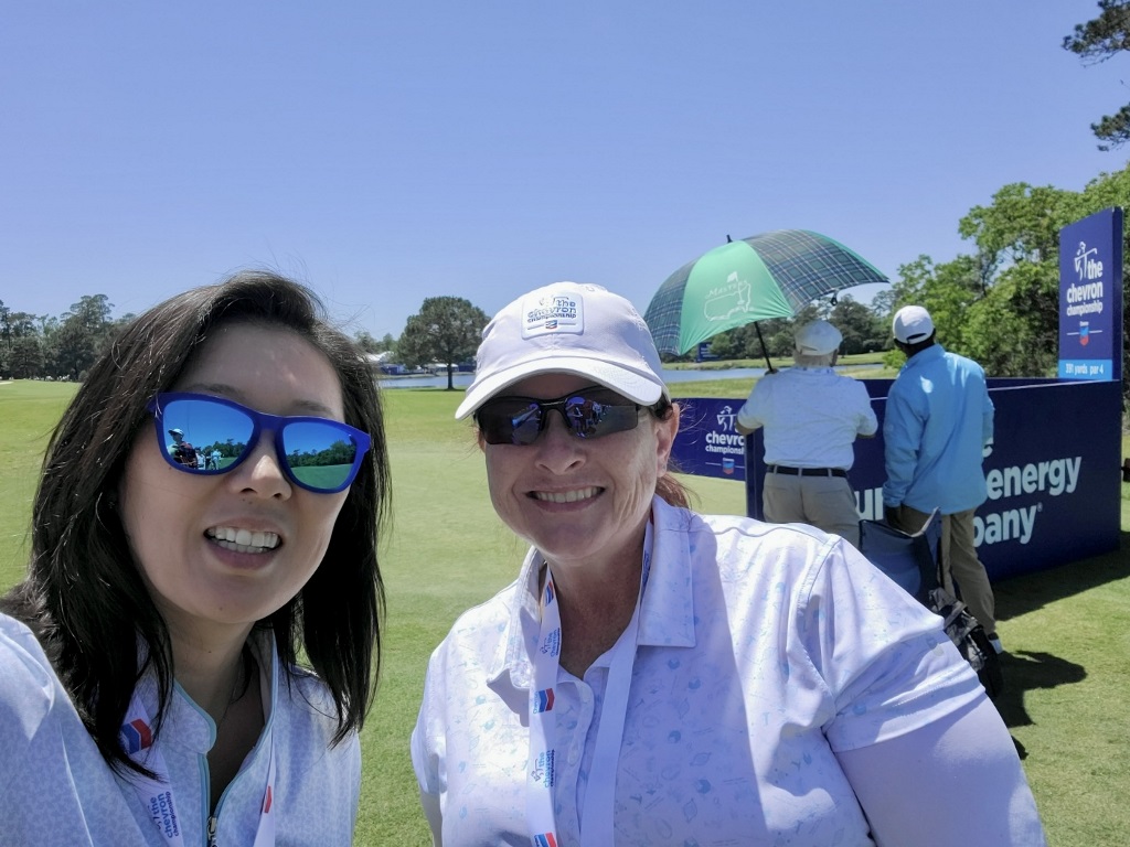 Two women taking a selfie while volunteering at the LPGA Chevron Championship in The Woodlands Texas