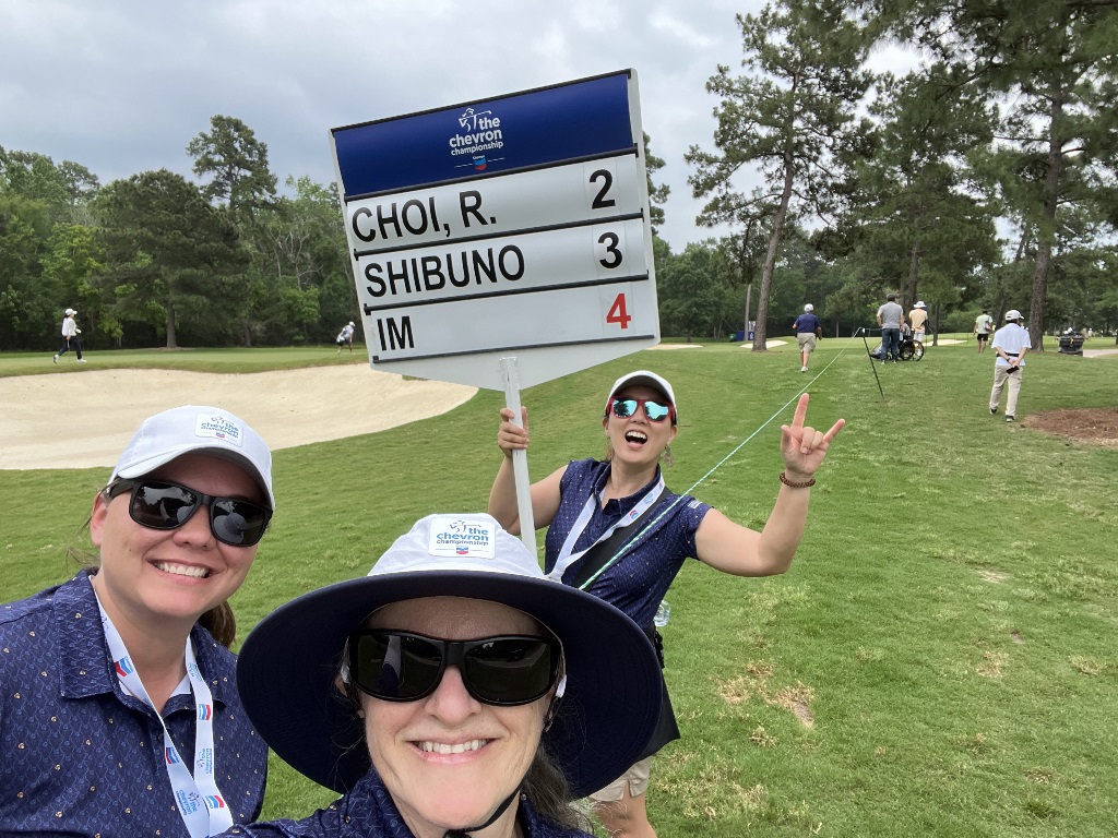 Three femal golfers taking a selfie while volunteering at the LPGA Chevron Championship in The Woodlands Texas