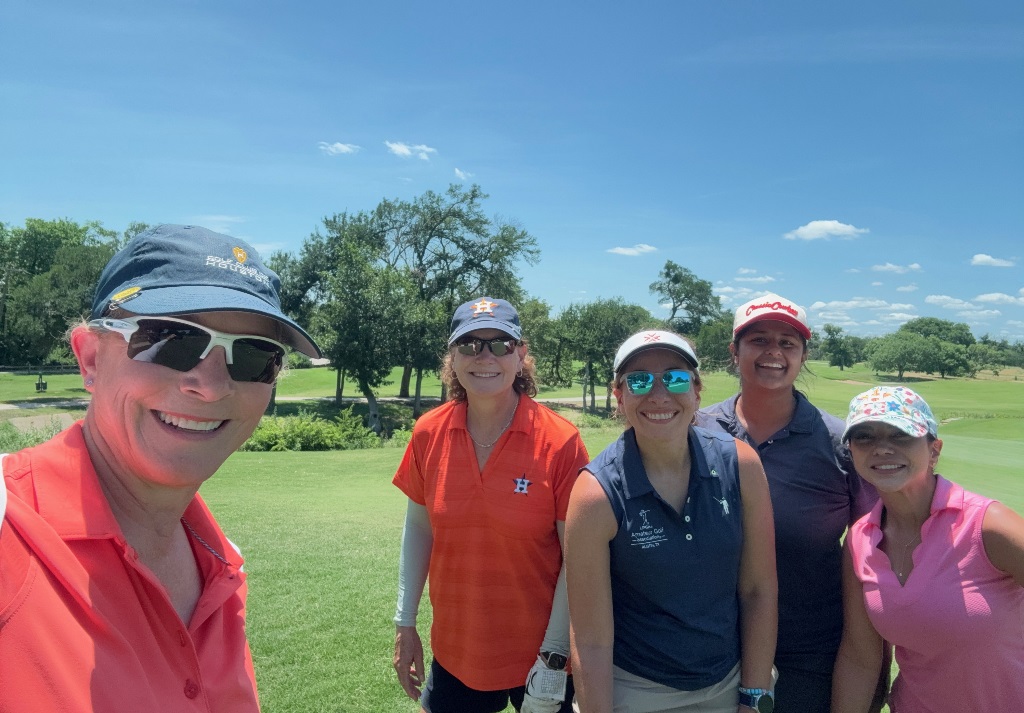 Five female golfers on a sunny day at a golf course in Houston Texas