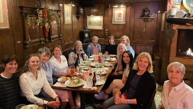 A group of female golfers at a social event with dinner and drinks in Houston Texas