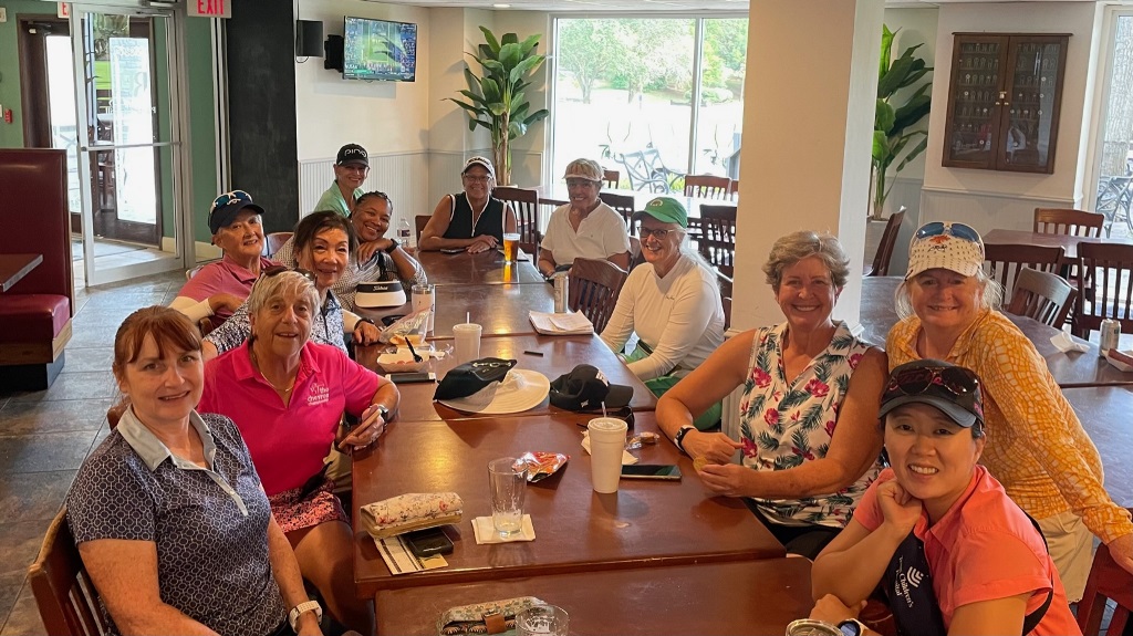 A group of female golfers having lunch in the clubhouse after a round of golf in Houston Texas